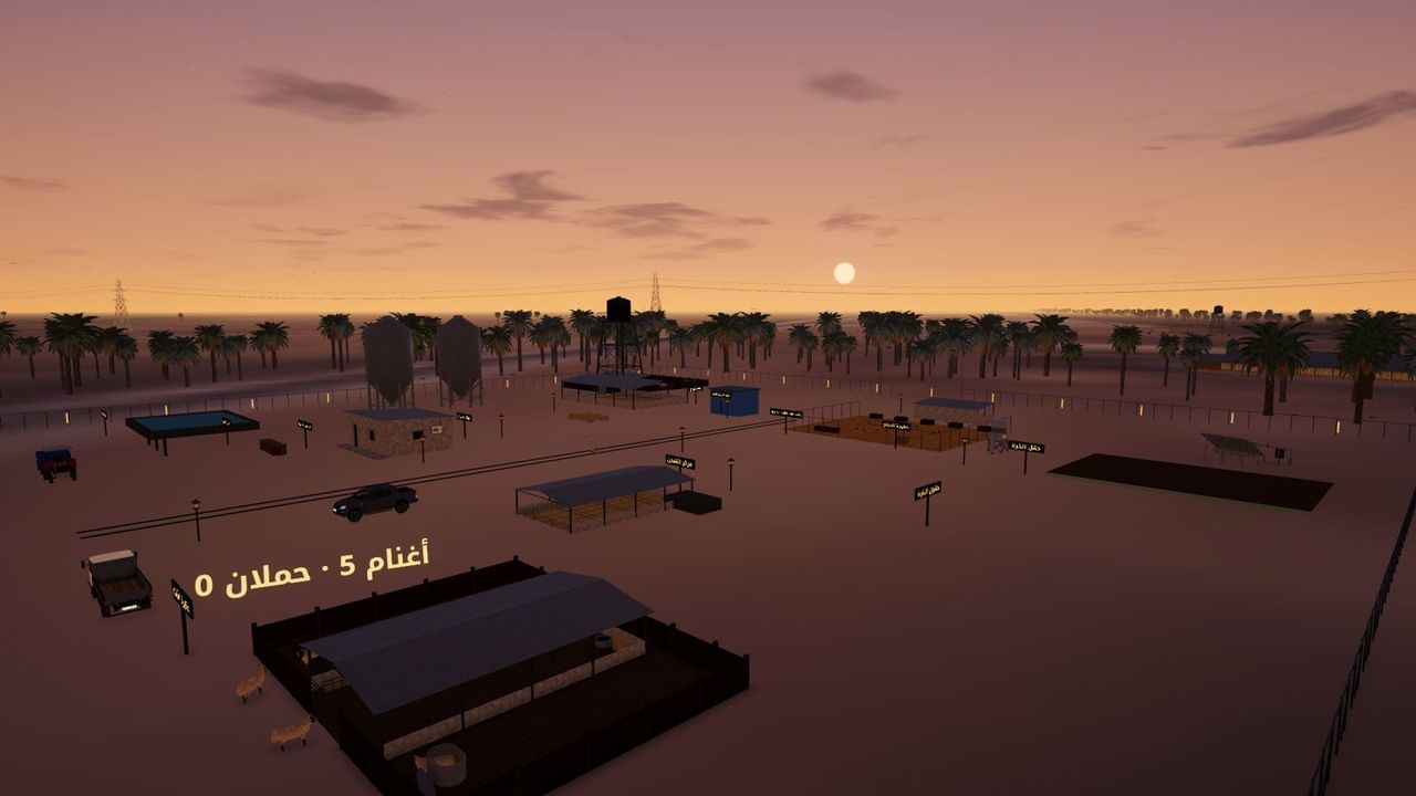 Sunset over a valley farm: a sheep pen, vehicles and palms